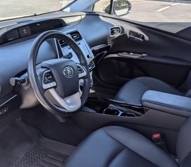 front seats of Toyota Prius 2017 car rental parked and ready in Baton Rouge