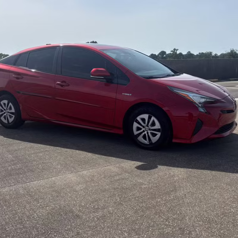 side view of Toyota Prius 2017 car rental parked and ready in Baton Rouge